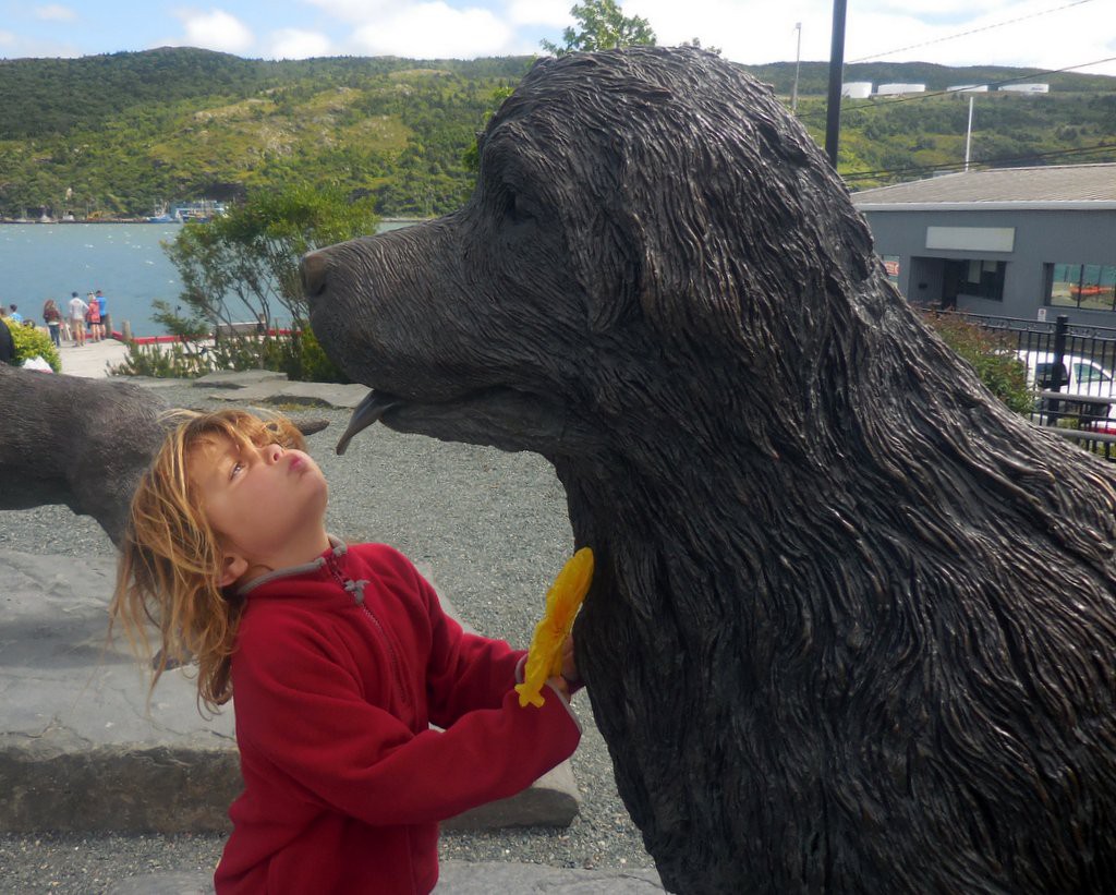 Little Kid with a Newfoundland dog